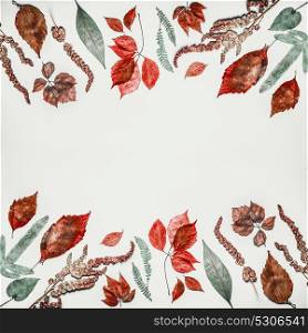 Autumn composing or pattern background made with various colorful fall leaves on light background, top view, frame