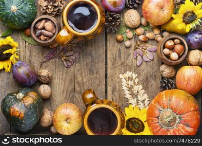 Autumn composing with pumpkin, fruit and fall leaves.Autumn background. Beautiful autumn composition