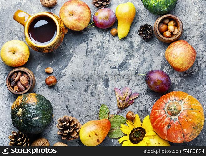 Autumn composing with pumpkin, fruit and fall leaves.Autumn background. Beautiful autumn composition