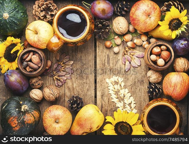 Autumn composing with pumpkin, fruit and fall leaves.Autumn food. Beautiful autumn composition