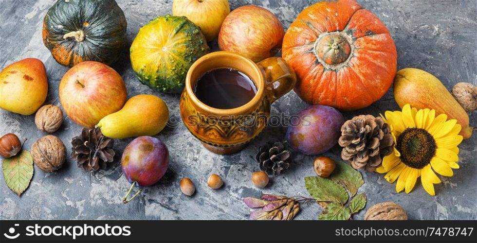Autumn composing with pumpkin, fruit and fall leaves. Beautiful autumn composition