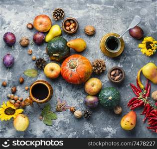 Autumn composing with pumpkin, fruit and fall leaves.Fall still life. Autumn harvest still life