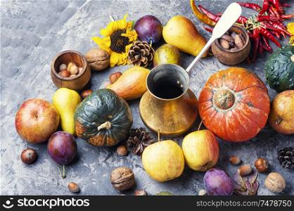 Autumn composing with pumpkin, fruit and fall leaves.Fall still life. Autumn harvest still life
