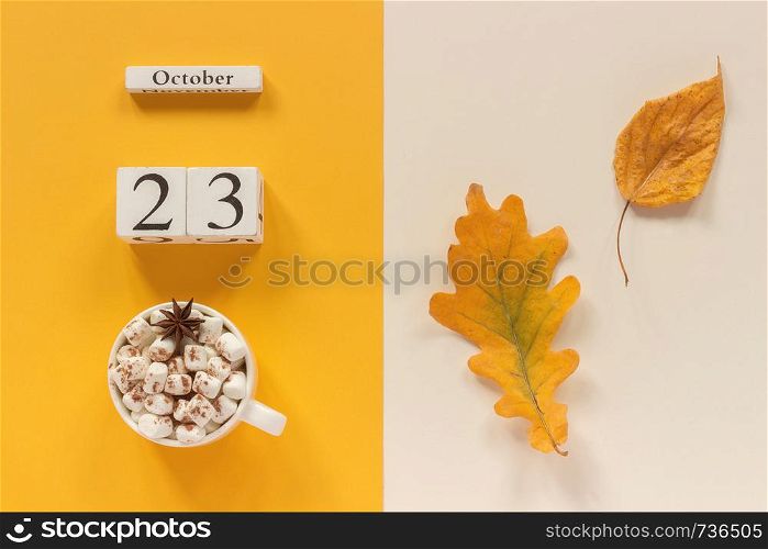 Autumn composition. Wooden calendar October 23 , cup of cocoa with marshmallows and yellow autumn leaves on yellow beige background. Top view Flat lay Mockup Concept Hello September.. Autumn composition. Wooden calendar October 23, cup of cocoa with marshmallows and yellow autumn leaves on yellow beige background. Top view Flat lay Mockup Concept Hello September