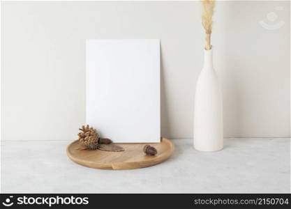 Autumn concept, Blank paper cards Mockup with dried leaves. and pine cones on beige background with copy space
