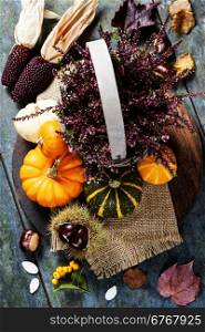Autumn concept with seasonal fruits and vegetables on wooden board