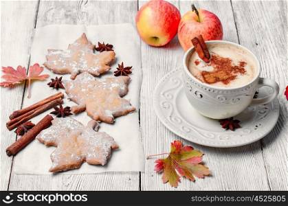 autumn cookies and coffee. Cookies in the shape of maple autumn leaf and and coffee