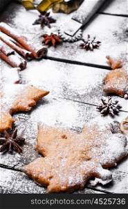 Autumn cookies spices. Homemade biscuits in the form of maple leaves covered with snow