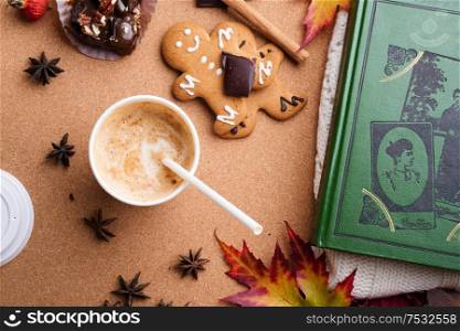 autumn cozy composition with book at wooden table. life style concept. flat lay