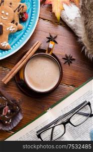 autumn cozy composition with coffe and book at wooden table. life style concept. flat lay