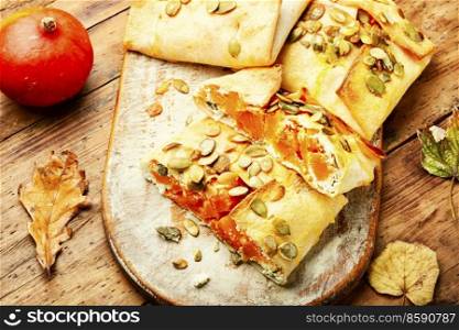 Autumn dessert of pita bread filled with sweet pumpkin, fall food. Sweet pumpkin baked,seasonal food