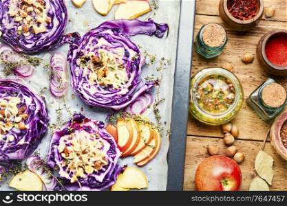 Autumn dish of red cabbage baked with nuts and apples. Baked red cabbage with hazelnuts