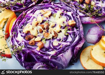Autumn dish of red cabbage baked with nuts and apples. Roasted red cabbage steak