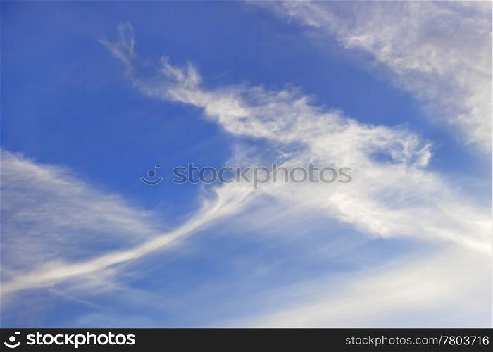 Autumn elongated stratospheric clouds against a blue sky