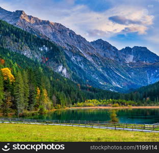 Autumn evening alpine Jaegersee lake and mountains above, Kleinarl, Land Salzburg, Austria. Picturesque hiking, seasonal, and nature beauty concept scene.