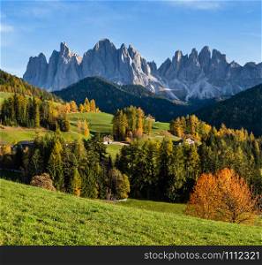 Autumn evening Santa Magdalena famous Italy Dolomites village surroundings view in front of the Geisler or Odle Dolomites mountain rocks. Picturesque traveling and countryside beauty concept scene.