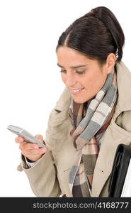 Autumn fashion pretty business woman portrait with phone typing