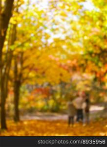 Autumn golden park, blurred background.
