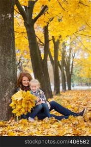 autumn. happy family - smiling mother with daughter outdoors