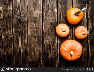 Autumn harvest. A ripe pumpkins. On a wooden table.. Autumn harvest. A ripe pumpkins.