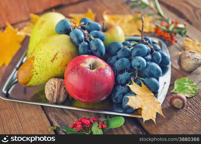 autumn harvest on wooden background,autumn background