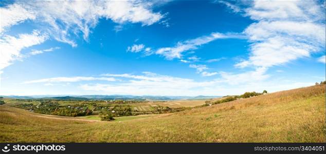 Autumn hilly country valley panorama. Five shots stitch image.