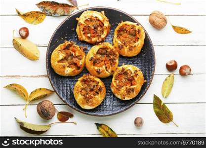 Autumn homemade pastries.Tasty buns with minced meat and pumpkin.. Pumpkin and meat buns
