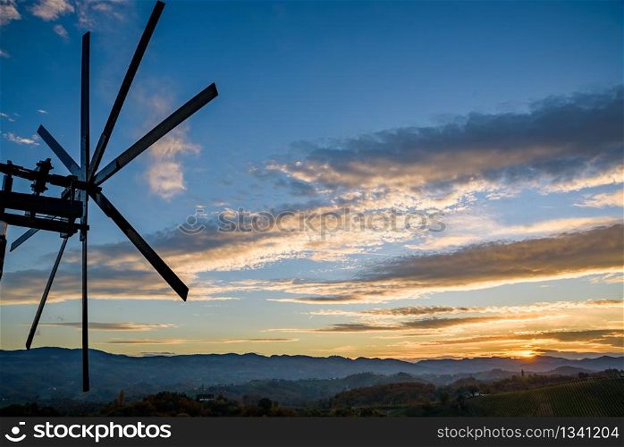 Autumn in southern styria. Vineyard fields country in austria Sunset.. Windmill in southern styria tourist spot
