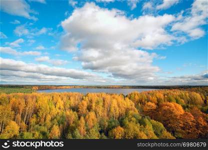Autumn landscape . Clouds over lake with yellow trees.. Autumn landscape . Clouds over the lake with yellow trees.