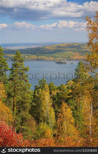 autumn landscape with lake and cloud sky