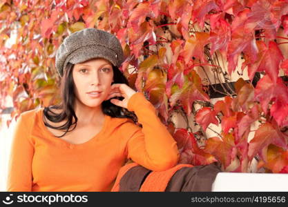 Autumn leaves park scenery young woman relax sitting on bench