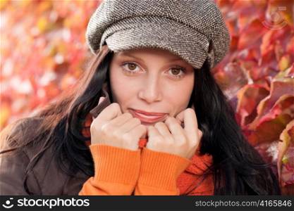 Autumn leaves portrait of beautiful female model posing fashion outfit