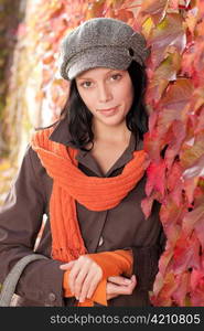 Autumn leaves portrait of beautiful female model posing fashion outfit