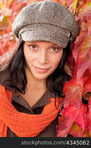 Autumn leaves portrait of beautiful female model posing fashion outfit