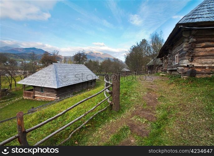 Autumn misty mountain village with wooden house (Carpathian , Ukraine).