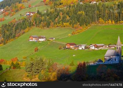 Autumn morning Santa Magdalena famous Italy Dolomites mountain village environs view. Picturesque traveling, seasonal and countryside beauty concept background.