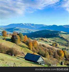 Autumn mountain country landscape with village on slope  Carpathian, Ukraine .