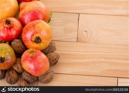 Autumn nature fruits concept. Fall fruits on a wooden table, studio picture