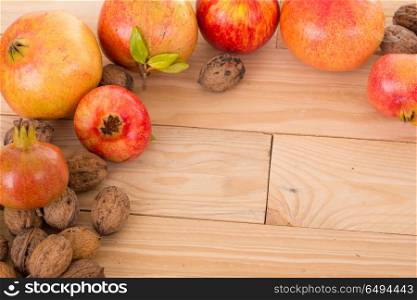 Autumn nature fruits concept. Fall fruits on a wooden table, studio picture. Autumn fruits
