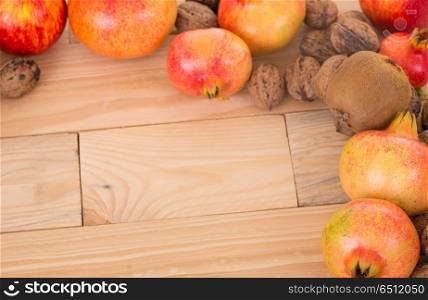 Autumn nature fruits concept. Fall fruits on a wooden table, studio picture. Autumn fruits