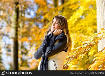 Autumn park - fashion model woman on sunny day
