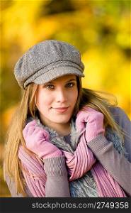 Autumn park - fashion model woman wear cap on sunny day