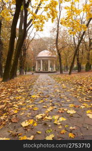 Autumn park with a footpath to summer house. The Lvov park