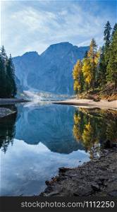 Autumn peaceful alpine lake Braies or Pragser Wildsee. Fanes-Sennes-Prags national park, South Tyrol, Dolomites Alps, Italy, Europe. People are unrecognizable.