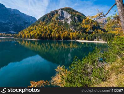 Autumn peaceful alpine lake Braies or Pragser Wildsee. Fanes-Sennes-Prags national park, South Tyrol, Dolomites Alps, Italy, Europe. People are unrecognizable.