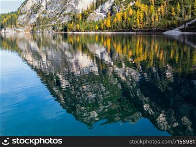 Autumn peaceful alpine lake Braies or Pragser Wildsee. Fanes-Sennes-Prags national park, South Tyrol, Dolomites Alps, Italy, Europe. Picturesque traveling, seasonal and nature beauty concept scene.