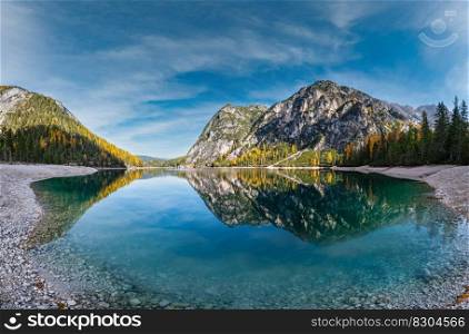 Autumn peaceful alpine lake Braies or Pragser Wildsee. Fanes-Sennes-Prags national park, South Tyrol, Dolomites Alps, Italy, Europe. Picturesque traveling, seasonal and nature beauty concept scene.