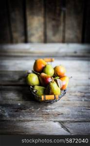Autumn pears on rustic wooden background