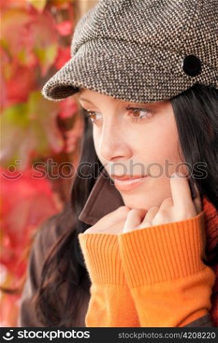 Autumn portrait of beautiful female model posing face close-up