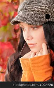 Autumn portrait of beautiful female model posing face close-up